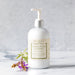 Bottle of Park Hill Country French Lavender hand lotion on a light background