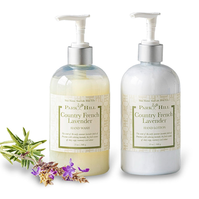 Two bottles of Park Hill Country French Lavender hand wash and lotion with lavender flowers on a white background.
