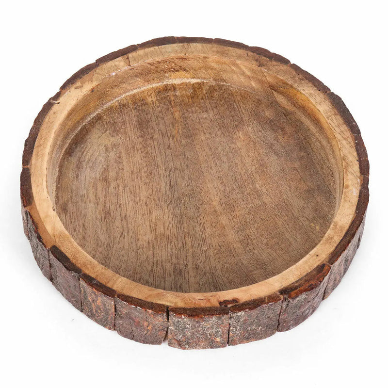 Wooden bowl with natural edge on a white background