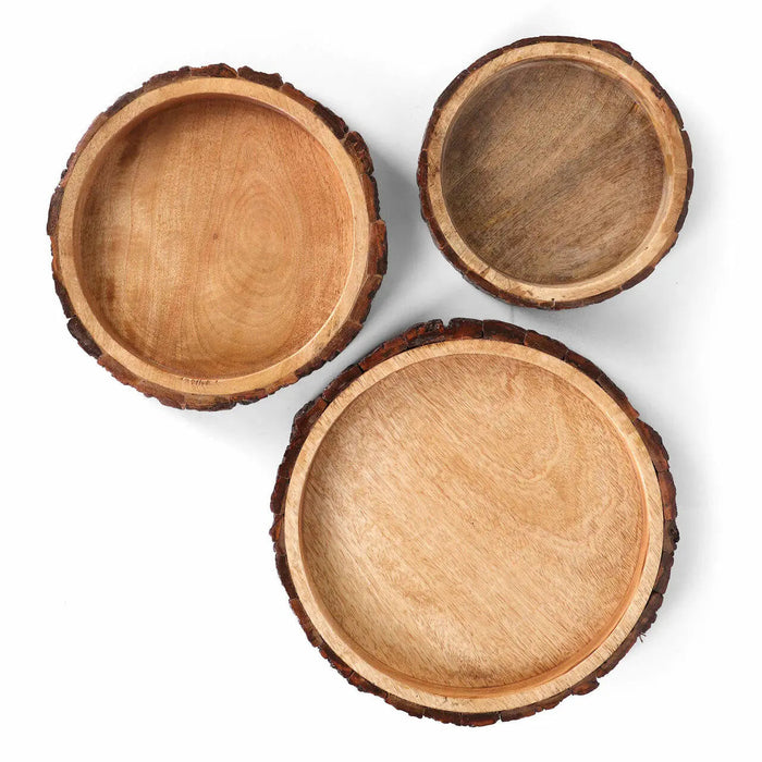 Three wooden bowls of different sizes on a white background