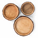 Three wooden bowls of different sizes on a white background