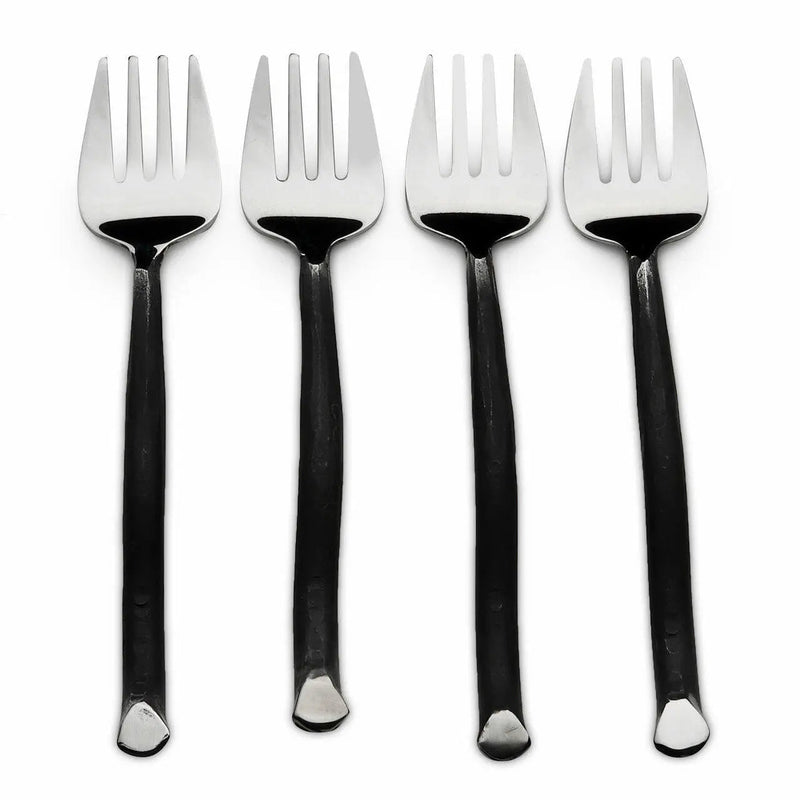 Four black-handled forks with silver tips on a white background